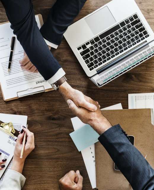 Business people shaking hands together